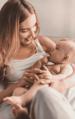 Parents cradling their newborn together during a family session