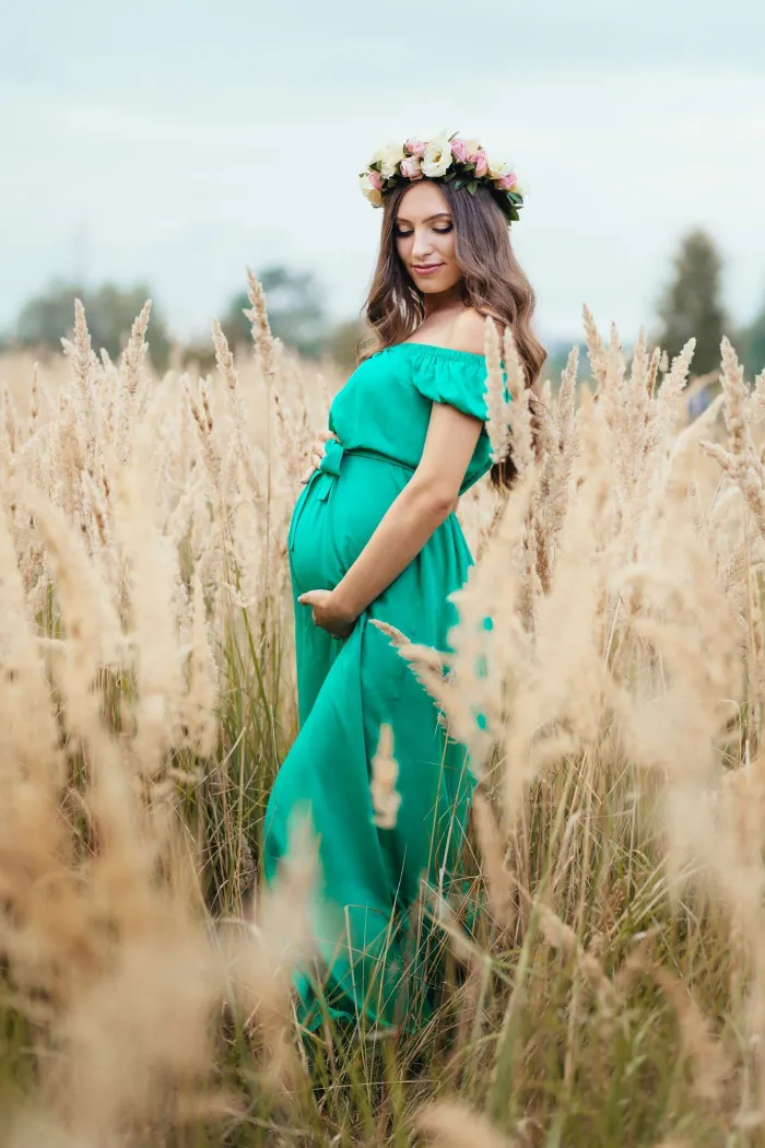 Maternity photoshoot at 8 Lenses — flowing gown, warm studio light, Kurla Mumbai